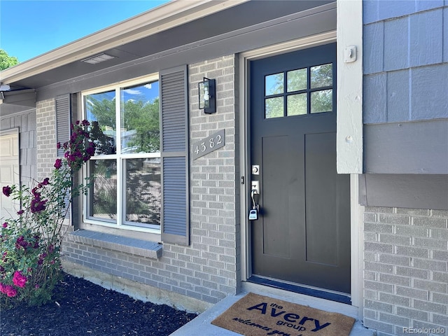 4382 S Xenon St, Morrison, CO 80465 - entrance to property featuring brick siding and covered porch