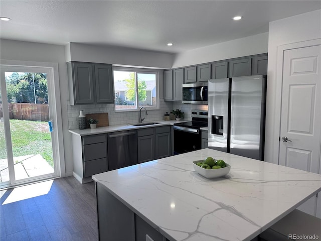 4382 S Xenon St, Morrison, CO 80465 - kitchen featuring stainless steel appliances, gray cabinetry, backsplash, and recessed lighting