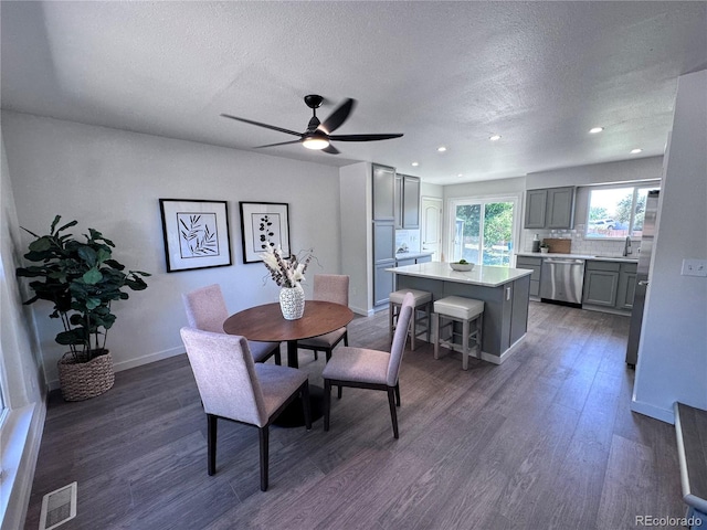 4382 S Xenon St, Morrison, CO 80465 - dining room featuring a textured ceiling, dark wood finished floors, ceiling fan, and recessed lighting