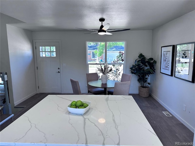 4382 S Xenon St, Morrison, CO 80465 - dining area with ceiling fan, dark wood finished floors, and a textured ceiling