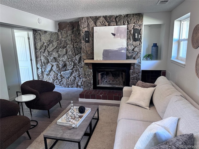 4382 S Xenon St, Morrison, CO 80465 - living room with a textured ceiling and a fireplace