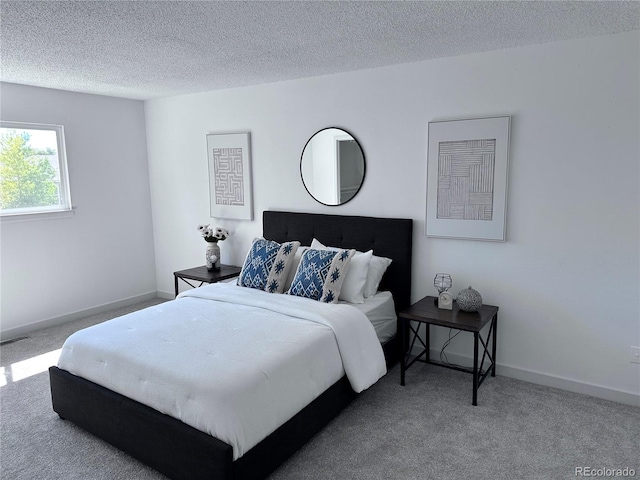 4382 S Xenon St, Morrison, CO 80465 - bedroom featuring carpet and a textured ceiling