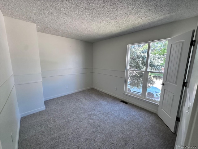 4382 S Xenon St, Morrison, CO 80465 - unfurnished room with a textured ceiling and carpet floors