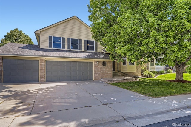 2552 E 126th Way, Thornton, CO 80241 - view of front of property featuring brick siding, a front yard, concrete driveway, an attached garage, and a shingled roof