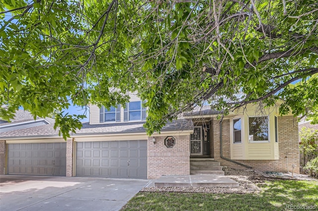 2552 E 126th Way, Thornton, CO 80241 - view of front of property with brick siding, concrete driveway, a garage, and roof with shingles