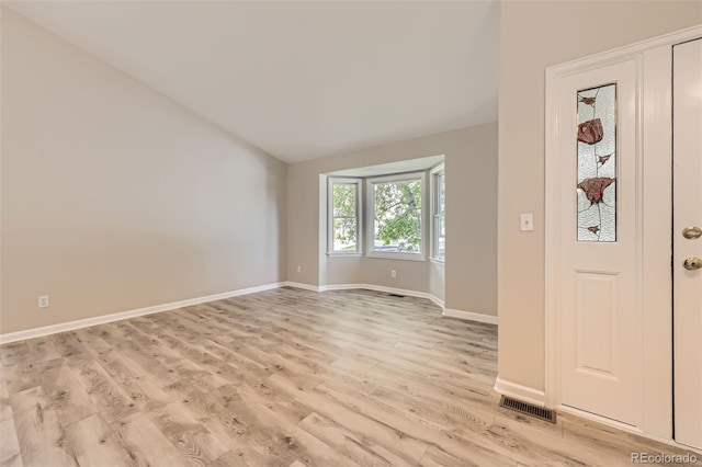 2552 E 126th Way, Thornton, CO 80241 - foyer with light wood finished floors, baseboards, and lofted ceiling