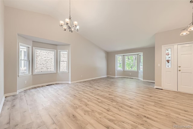 2552 E 126th Way, Thornton, CO 80241 - entryway featuring vaulted ceiling, light wood-type flooring, a chandelier, and baseboards