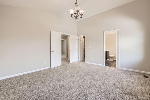 2552 E 126th Way, Thornton, CO 80241 - unfurnished bedroom featuring carpet flooring, high vaulted ceiling, a chandelier, baseboards, and a spacious closet