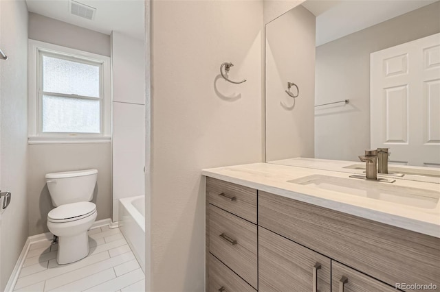 2552 E 126th Way, Thornton, CO 80241 - bathroom featuring vanity, toilet, and baseboards