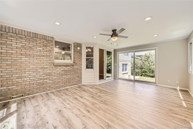 2552 E 126th Way, Thornton, CO 80241 - unfurnished living room featuring brick wall, ceiling fan, wood finished floors, recessed lighting, and baseboards