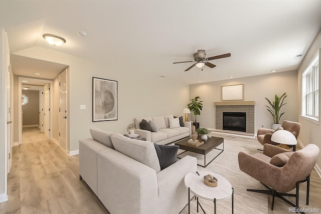 2552 E 126th Way, Thornton, CO 80241 - living room with light wood-style flooring, a ceiling fan, a fireplace, and recessed lighting