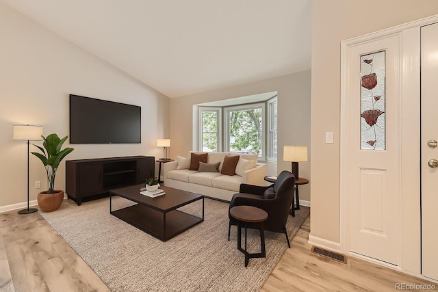 2552 E 126th Way, Thornton, CO 80241 - living area featuring light wood finished floors and lofted ceiling
