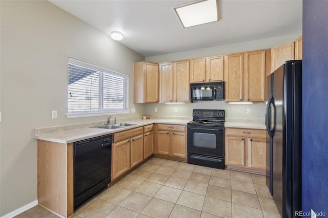 kitchen with black appliances, light brown cabinets, a sink, light tile patterned flooring, and light countertops