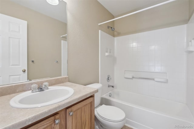 bathroom featuring vanity, toilet, and shower / washtub combination