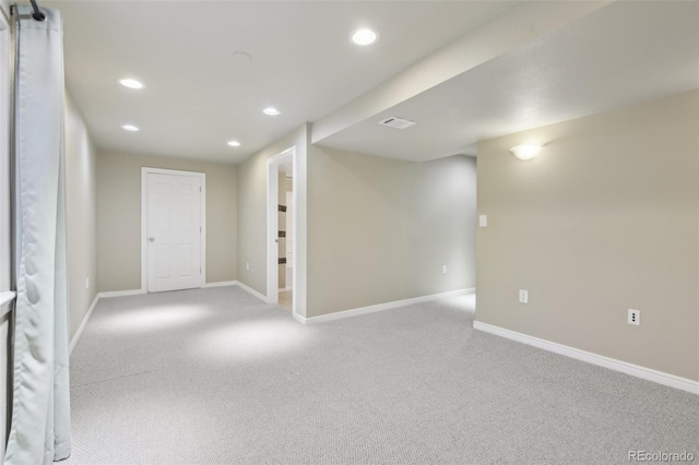 finished basement featuring visible vents, recessed lighting, baseboards, and carpet floors