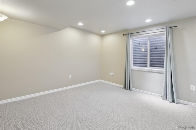 carpeted empty room with recessed lighting and baseboards