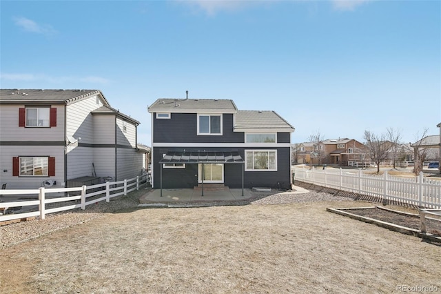 back of property with a patio and a fenced backyard