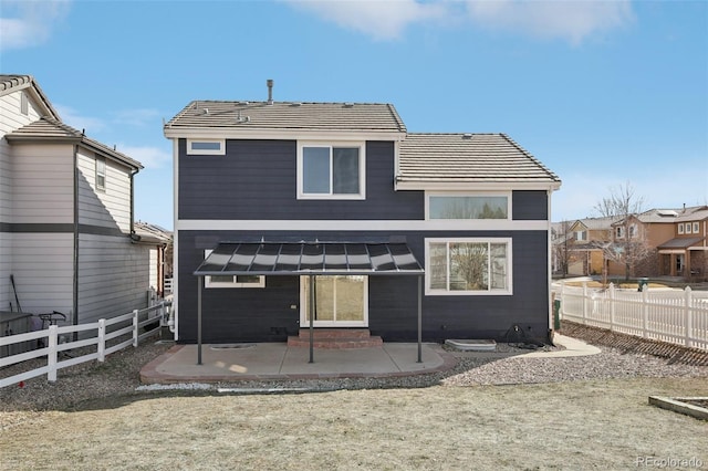 rear view of house featuring a patio, a fenced backyard, and entry steps