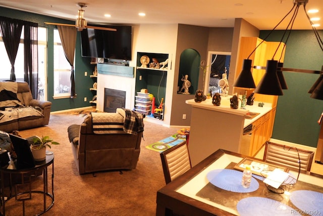 living room featuring carpet floors, recessed lighting, a fireplace, and baseboards