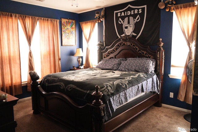 bedroom with baseboards and carpet flooring