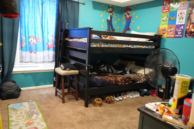 bedroom with carpet and baseboards