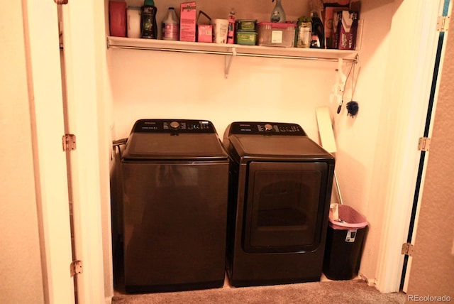 washroom featuring laundry area and washing machine and clothes dryer