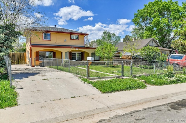6671 Grove St, Denver, CO 80221 - traditional-style home featuring driveway and a fenced front yard