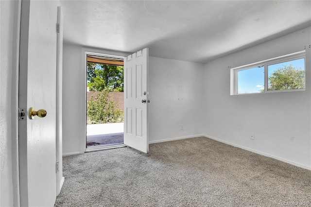 6671 Grove St, Denver, CO 80221 - entryway featuring carpet, healthy amount of natural light, and baseboards