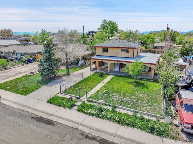 6671 Grove St, Denver, CO 80221 - victorian home with concrete driveway, covered porch, a residential view, and a mountain view