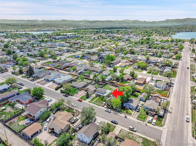 6671 Grove St, Denver, CO 80221 - aerial perspective of suburban area with a water and mountain view