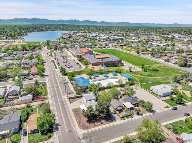6671 Grove St, Denver, CO 80221 - aerial perspective of suburban area with a water and mountain view