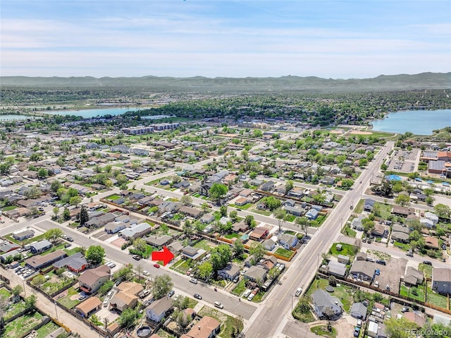 6671 Grove St, Denver, CO 80221 - aerial overview of property's location featuring a water and mountain view and nearby suburban area