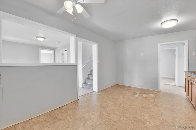 6671 Grove St, Denver, CO 80221 - empty room featuring ceiling fan and stairs