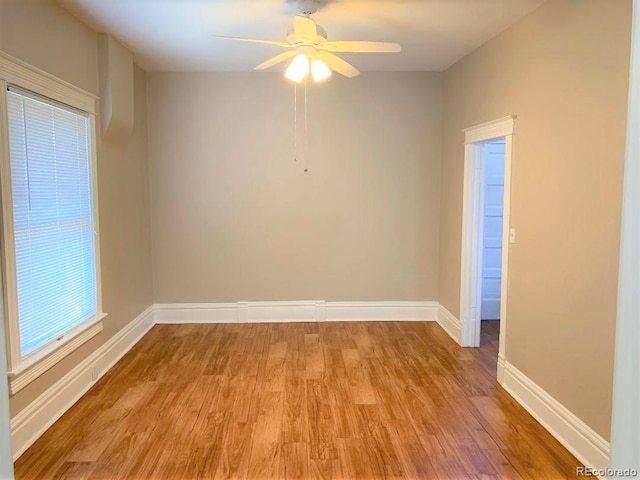 unfurnished room featuring ceiling fan and light wood-type flooring