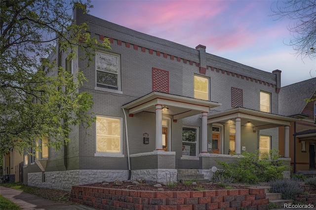 view of front of house with brick siding