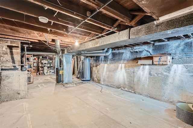unfinished below grade area with water heater and heating unit