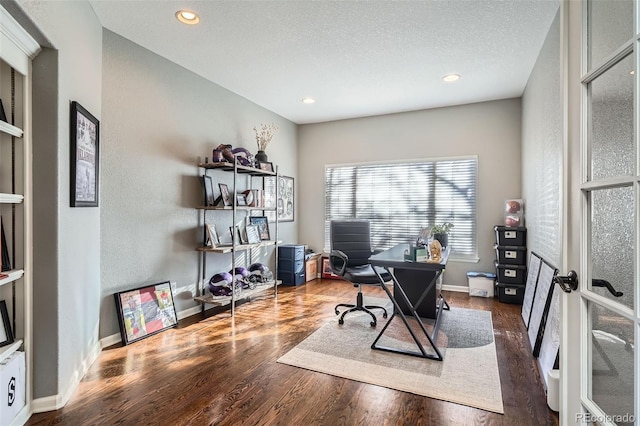 office area featuring a textured ceiling, french doors, and dark hardwood / wood-style floors