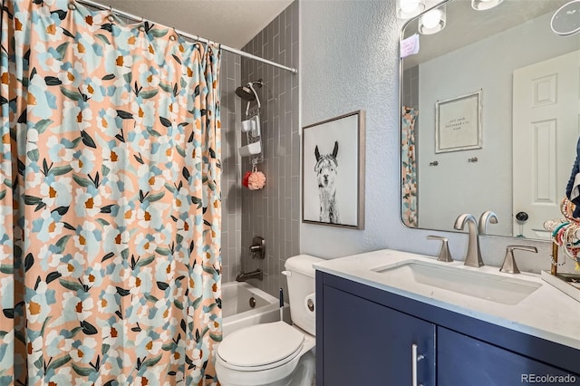 full bathroom featuring toilet, vanity, a textured ceiling, and shower / bath combination with curtain