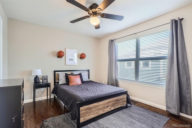 bedroom featuring ceiling fan and dark hardwood / wood-style flooring