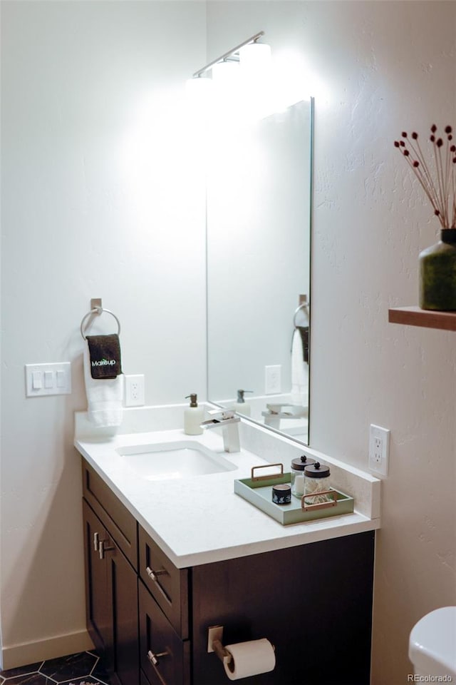 bathroom featuring tile patterned flooring and vanity