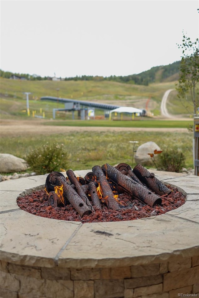 exterior space featuring a fire pit and a rural view