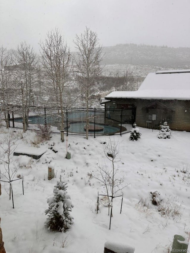 view of yard covered in snow