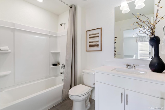 bathroom with vanity, shower / bath combo, and toilet