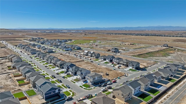 drone / aerial view with a residential view and a mountain view