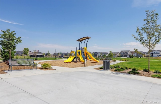 communal playground featuring a residential view