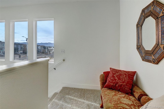 sitting room featuring light colored carpet