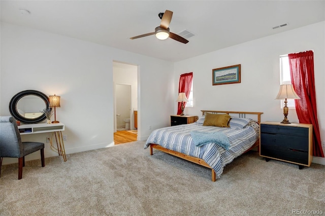 carpeted bedroom featuring ceiling fan and connected bathroom