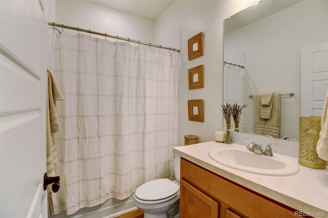 full bathroom featuring toilet, shower / tub combo, and vanity