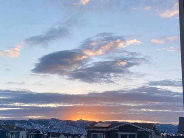 property view of mountains featuring a residential view