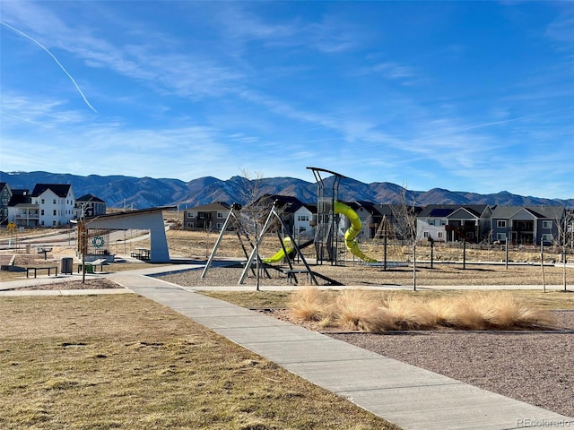 communal playground with central AC unit, a residential view, and a mountain view